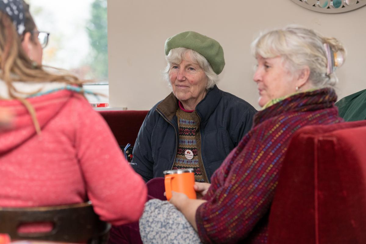 People sitting together chatting at a warm hub