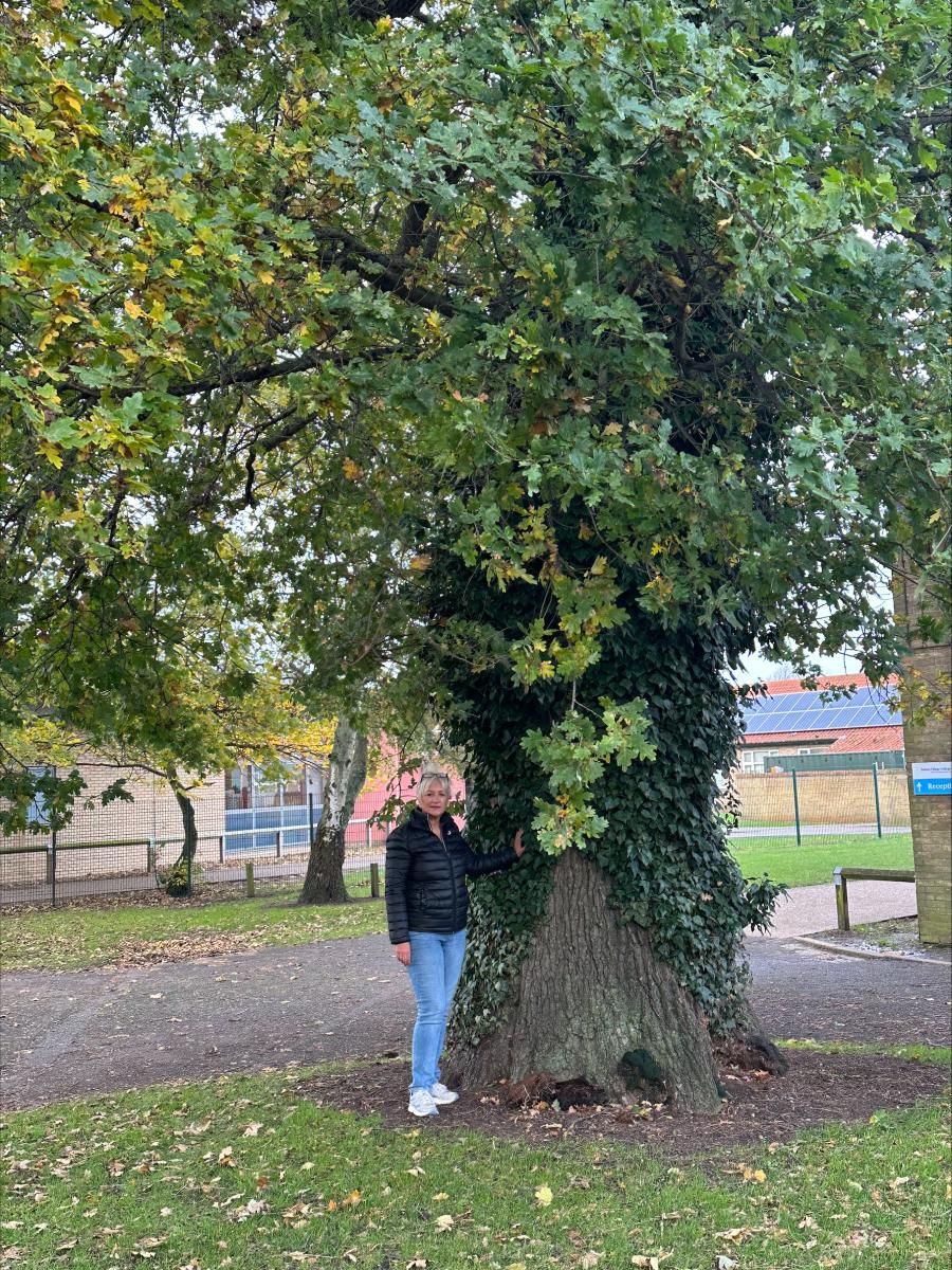 Cllr Julia Huffer beneath an oak tree